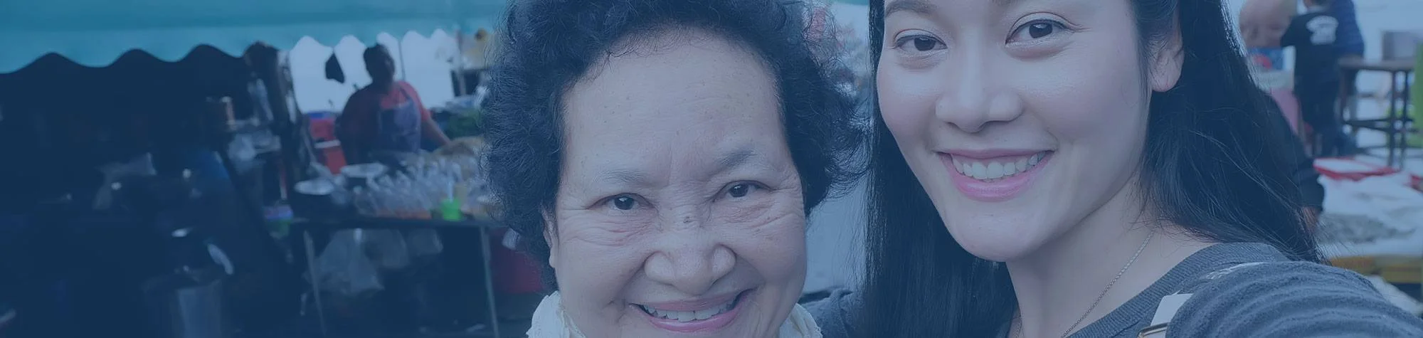 Older woman at home, supported with medication and hydration reminders by phone